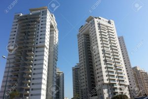 Modern, new executive apartments  buildings with deep blue summer sky